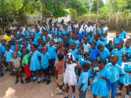 Students in blue uniforms gathered for a school assembly at a Starfysh-supported school on La Gonave.