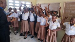 Students on La Gonave celebrating together inside their Starfysh-supported classroom.
