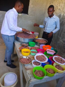 Local kitchen staff on La Gonave preparing nutritious school meals for Starfysh students.