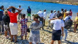 A baptism taking place in the Gulf of La Gonave as new believers publicly express their faith.
